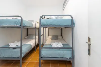 Cama o camas de una habitación en Casa de pescadores frente al mar en Calella