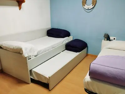 Cama o camas de una habitación en Apart 1º & Spa and Parking in Calella, Barcelona