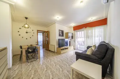 Una televisión o centro de entretenimiento en HomeHolidaysRentals Coquette - Costa Barcelona