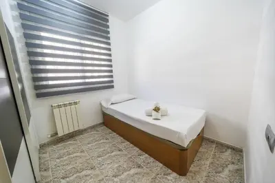 Cama o camas de una habitación en HomeHolidaysRentals Coquette - Costa Barcelona