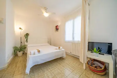 Cama o camas de una habitación en HomeHolidaysRentals Olimpia - Costa Barcelona