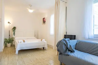Cama o camas de una habitación en HomeHolidaysRentals Olimpia - Costa Barcelona
