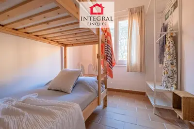 Cama o camas de una habitación en El Secret de la Fosca