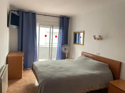Cama o camas de una habitación en Apartamento soleado junto al mar Els Pins