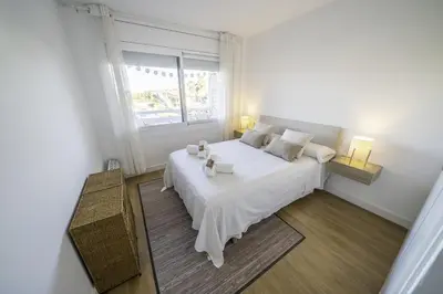 Cama o camas de una habitación en HomeHolidaysRentals Pinedalovers - Costa Barcelona