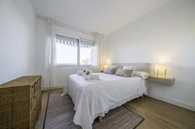 Cama o camas de una habitación en HomeHolidaysRentals Pinedalovers - Costa Barcelona