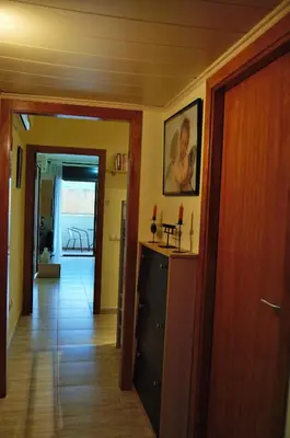 Una televisión o centro de entretenimiento en Arion Garden Apartment