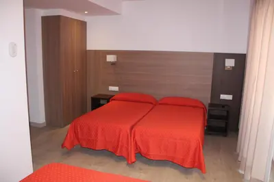 Cama o camas de una habitación en Hotel Victoria