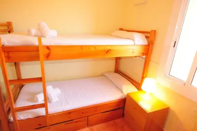 Cama o camas de una habitación en HomeHolidaysRentals Aqua