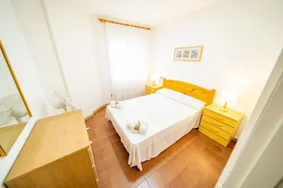 Cama o camas de una habitación en HomeHolidaysRentals Sol