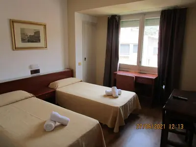 Cama o camas de una habitación en Hotel Apartaments Gesòria Porta Ferrada