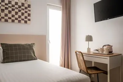 Cama o camas de una habitación en BYPILLOW Erba