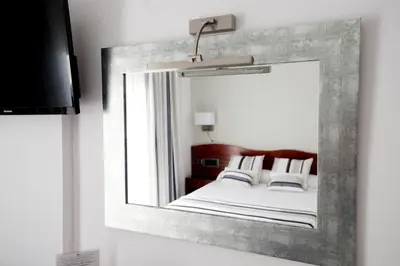 Cama o camas de una habitación en Hotel Plaça