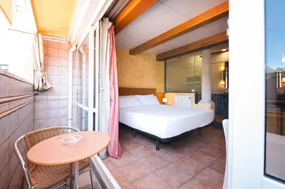 Cama o camas de una habitación en Hotel Plaça