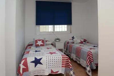 Cama o camas de una habitación en Brisa Beach