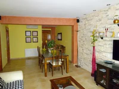 Una televisión o centro de entretenimiento en Apartamento Tossasea