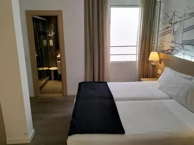 Cama o camas de una habitación en Hotel Mediterrani