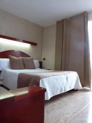 Cama o camas de una habitación en Hotel Hermes