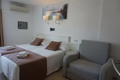 Cama o camas de una habitación en Hotel Hermes