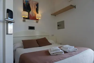 Cama o camas de una habitación en Hotel Hermes