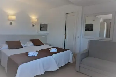 Cama o camas de una habitación en Hotel Hermes