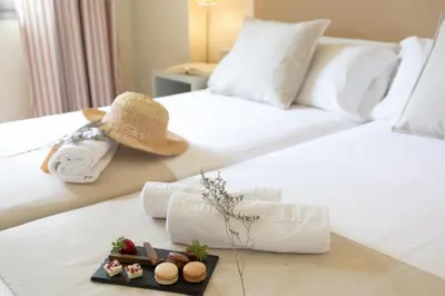 Cama o camas de una habitación en Aparthotel Ciutat de Palol