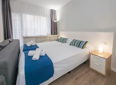 Cama o camas de una habitación en Hotel Victoria