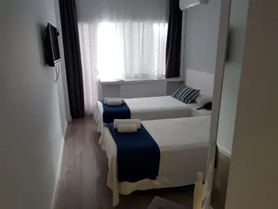 Cama o camas de una habitación en Hotel Victoria