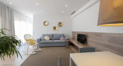 Una televisión o centro de entretenimiento en Cliper Apartments by Escampa Hotels
