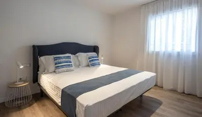 Cama o camas de una habitación en Cliper Apartments by Escampa Hotels