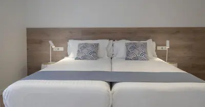 Cama o camas de una habitación en Cliper Apartments by Escampa Hotels
