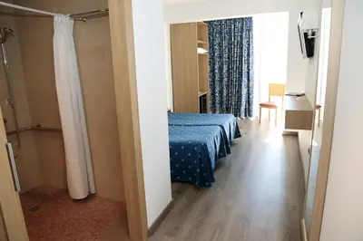 Cama o camas de una habitación en Hotel Acapulco