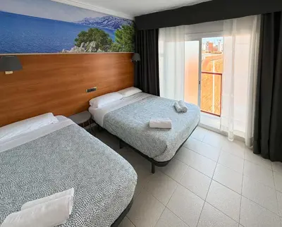 Cama o camas de una habitación en Hotel Maremagnum