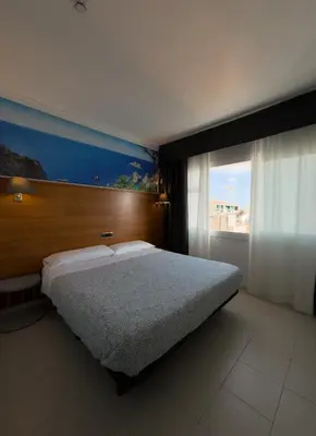 Cama o camas de una habitación en Hotel Maremagnum