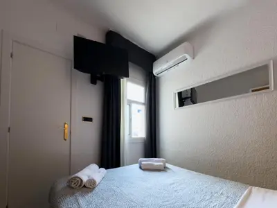 Cama o camas de una habitación en Hotel Maremagnum