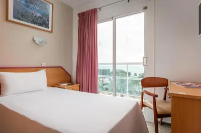 Cama o camas de una habitación en ALEGRIA Cartago Nova