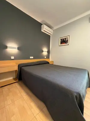 Cama o camas de una habitación en Hostal Tarrés
