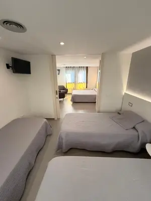 Cama o camas de una habitación en Hostal Tarrés
