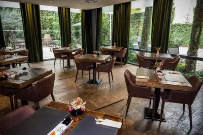 Un restaurante o sitio para comer en Hotel Nord 1901