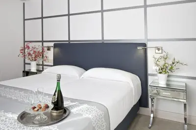 Cama o camas de una habitación en Hotel Rosamar