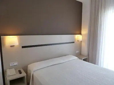 Cama o camas de una habitación en Hotel Costa Brava