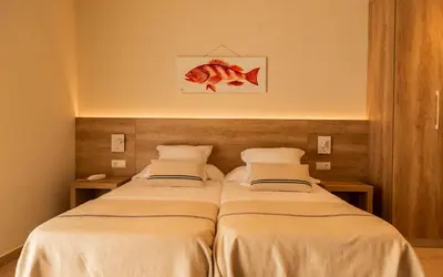 Cama o camas de una habitación en Hotel Tamariu