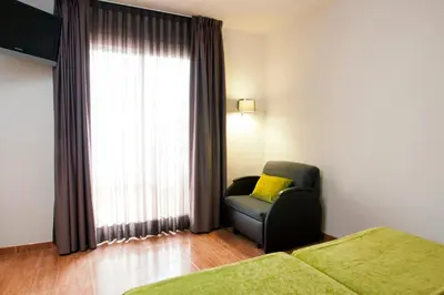 Cama o camas de una habitación en Bed and Breakfast El Pekinaire