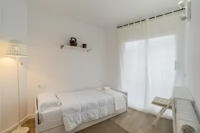 Cama o camas de una habitación en Apartamento con dos grandes terrazas en Girona