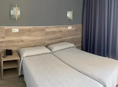 Cama o camas de una habitación en Hotel Reymar Playa