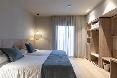 Cama o camas de una habitación en Hotel Casamar