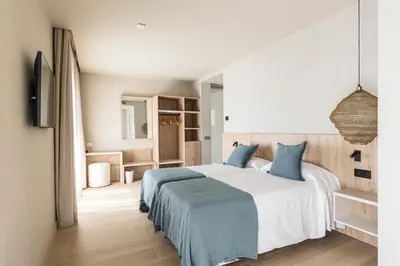 Cama o camas de una habitación en Hotel Casamar