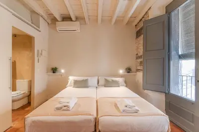 Cama o camas de una habitación en Flateli Ballesteries