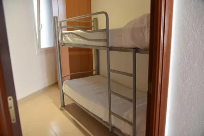 Cama o camas de una habitación en Apartamentos AR Dosjoimi
