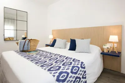 Cama o camas de una habitación en Pierre & Vacances Blanes Playa